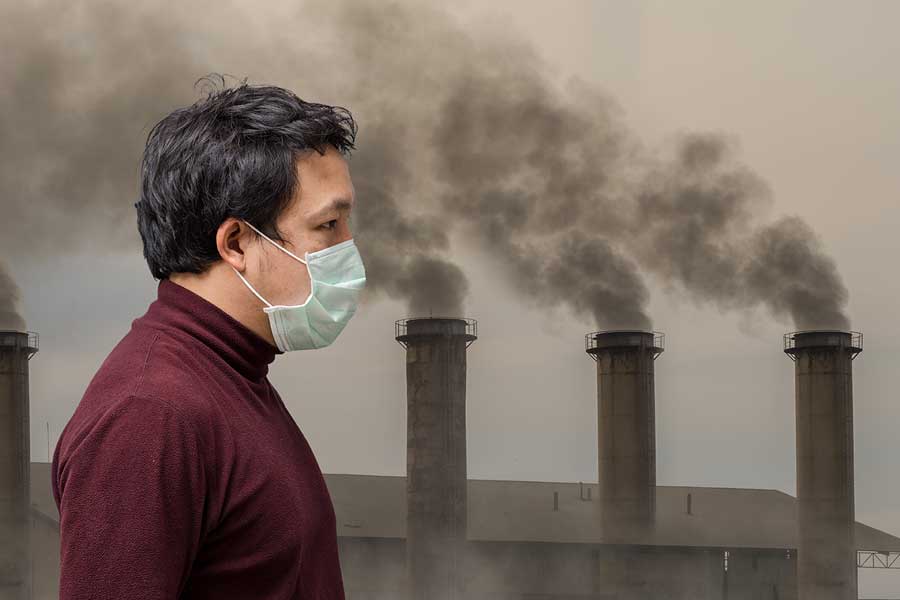 Man wearing mask in air pollution